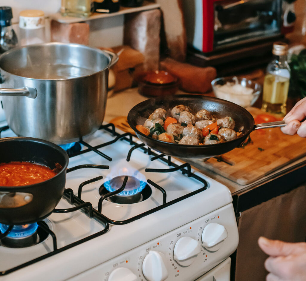 Cooking over a stove with gas