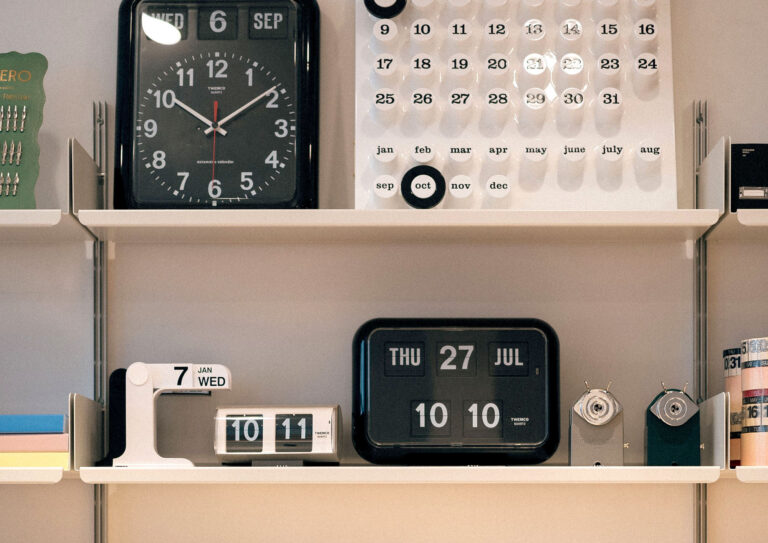 Calendars and clocks on shelves