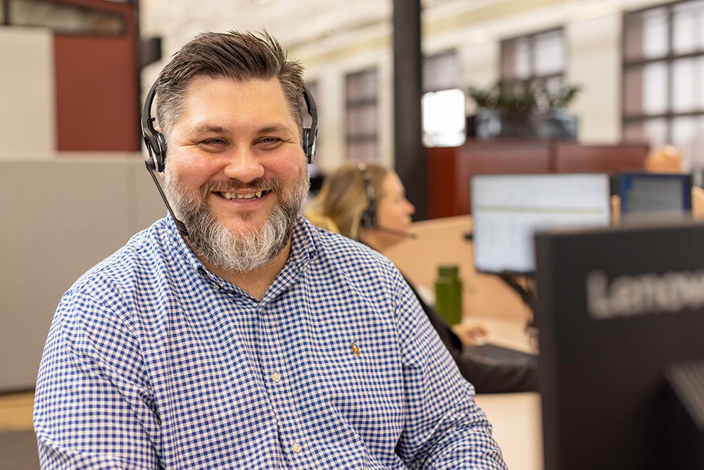 Red Energy support team member with headset on call