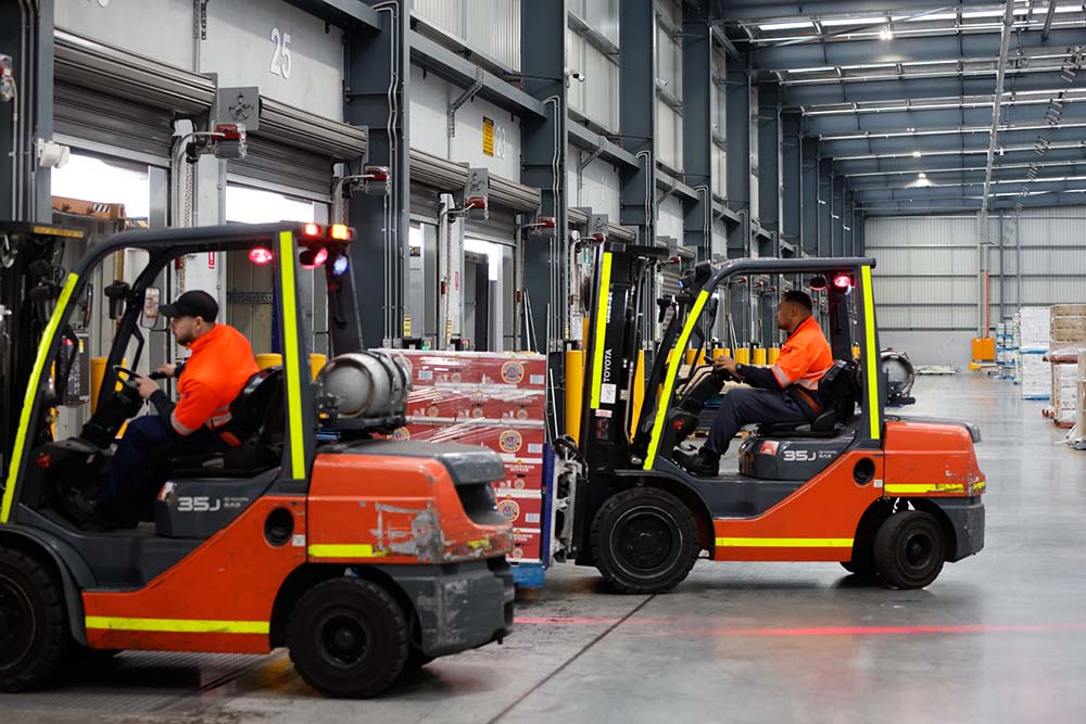 SCT Logistics forklifts driving in warehouse