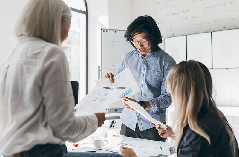 team look over paper chart