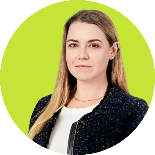 A woman with straight, long blonde hair wearing a black textured blazer over a white top, posed against a bright green background, represents the innovative spirit of AI in FP&A Melbourne.