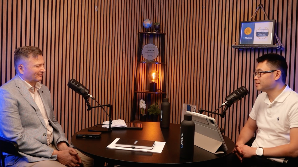 brett-ruwoldt-david-huynh-podcast Brett Ruwoldt and David Huynh sitting at a table having a conversation